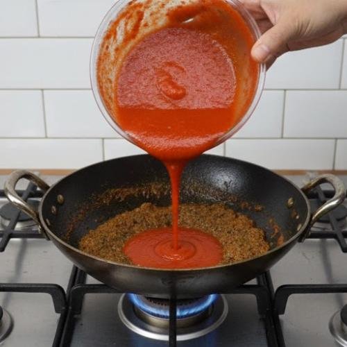 Step 4: Add the Tomato Puree and Cook